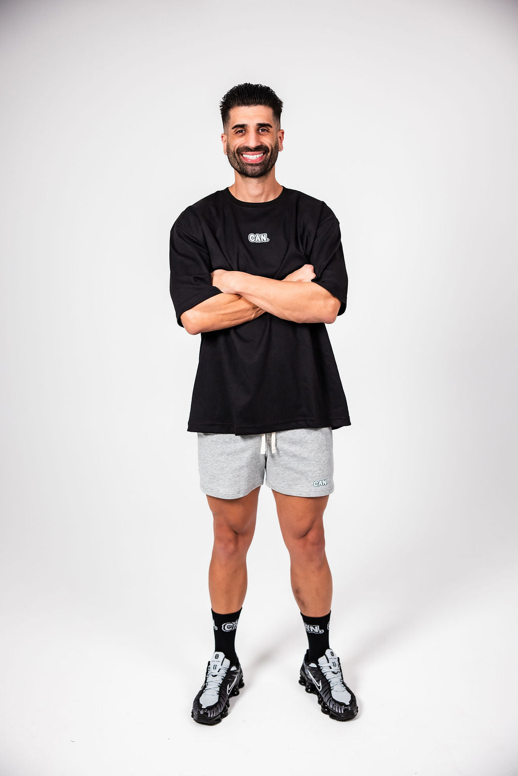 James Webb modelling black Can. Syndicate Active shorts, grey CAN. Active shorts and black CAN. crew socks. 