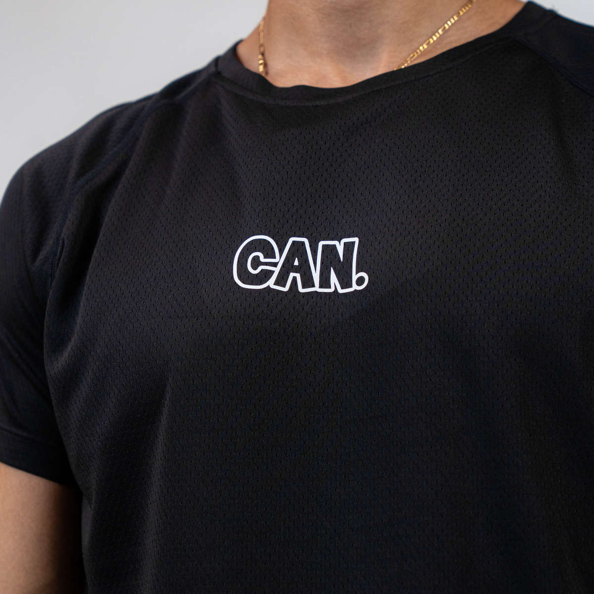 Black CAN. Syndicate Men's Athletic Tee with 'CAN.' logo on a grey background