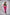 Woman modelling a black CAN. contour sculpt crop top and bright pink CAN. Syndicate Comfort Baggy Track Pants with white drawstrings and a large white 'CAN.' logo printed down the left leg, against a light grey studio background.