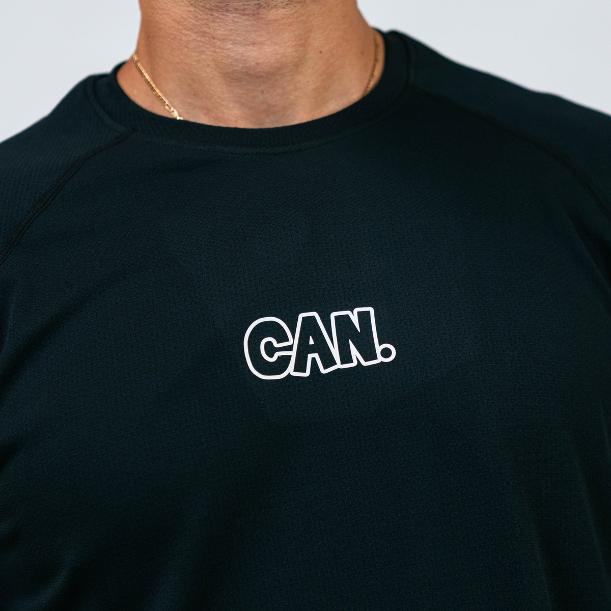 Black CAN. Syndicate Men's Long Sleeve Athletic Tee  with 'CAN.' text on a plain background