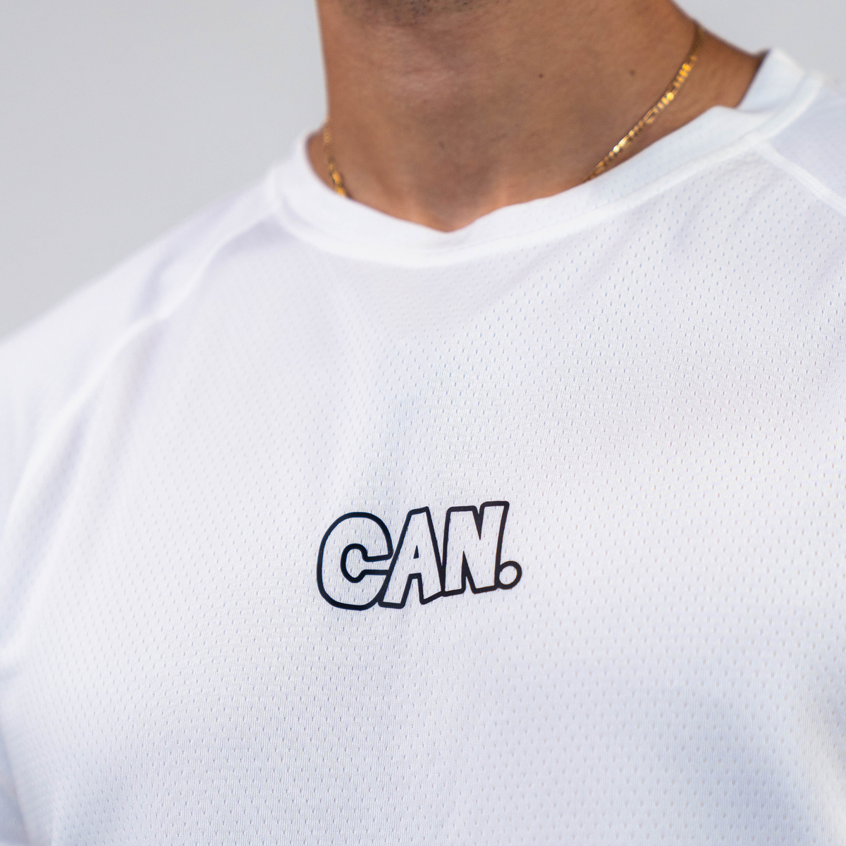 White CAN. Syndicate Men's Athletic Tee  with 'CAN.' text on a plain background